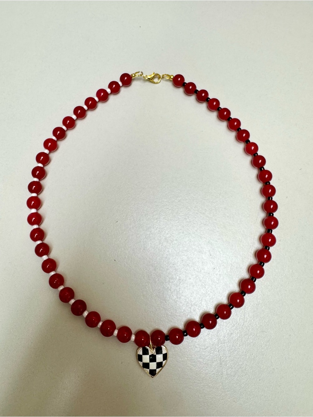 Red Beaded Necklace with Checkered Heart Pendant